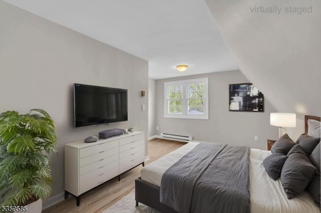10 Rutgers Way, Hopatcong Boro, NJ 07843 - bedroom with baseboard heating, wood finished floors, baseboards, and lofted ceiling