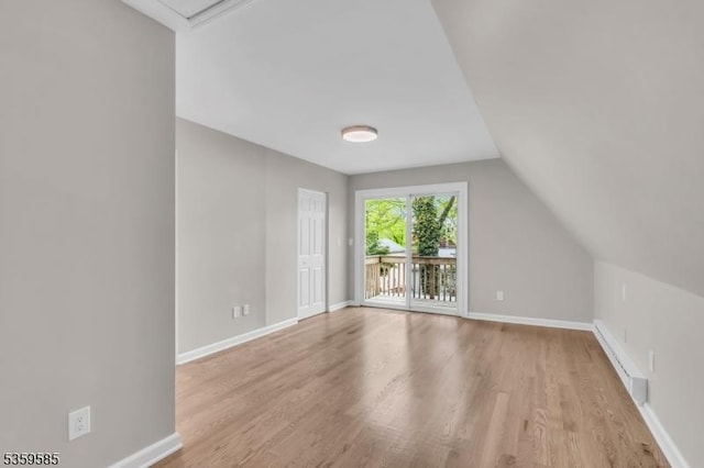 10 Rutgers Way, Hopatcong Boro, NJ 07843 - bonus room with light wood finished floors, a baseboard radiator, baseboards, and lofted ceiling