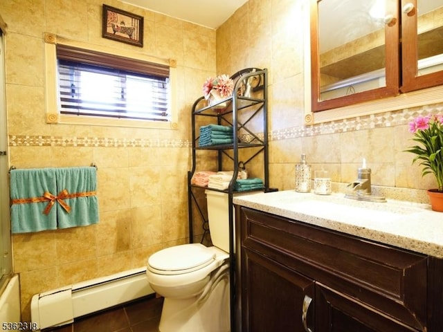 148 Hackensack St, Wood-Ridge Boro, NJ 07075 - full bathroom featuring baseboard heating, tile walls, vanity, tile patterned flooring, and toilet