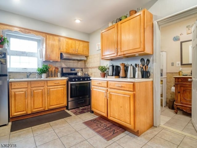 148 Hackensack St, Wood-Ridge Boro, NJ 07075 - kitchen featuring stainless steel appliances, under cabinet range hood, light countertops, and light tile patterned floors