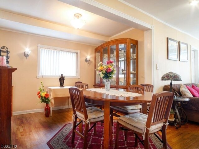 148 Hackensack St, Wood-Ridge Boro, NJ 07075 - dining area with wood finished floors, crown molding, and baseboards