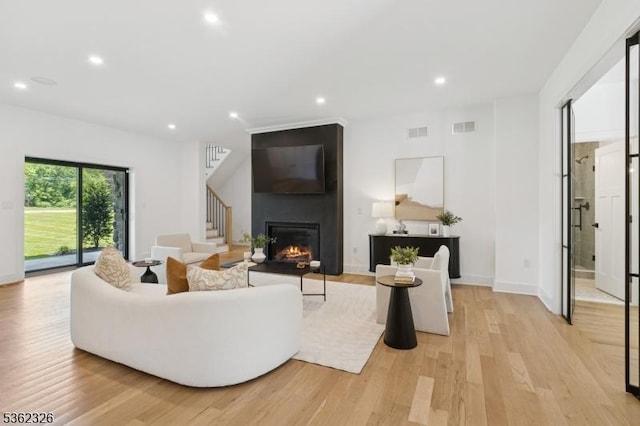 121 Culberson Rd, Bernards Twp, NJ 07920 - living area featuring light wood-type flooring, recessed lighting, stairway, a fireplace, and baseboards