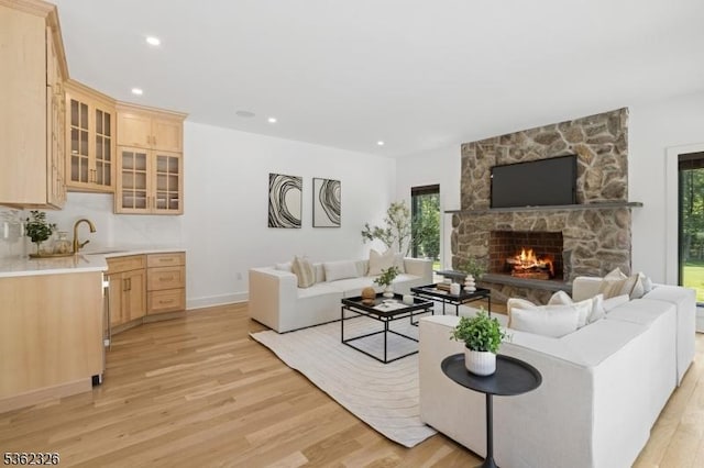 121 Culberson Rd, Bernards Twp, NJ 07920 - living room with light wood-style flooring, a stone fireplace, recessed lighting, and baseboards