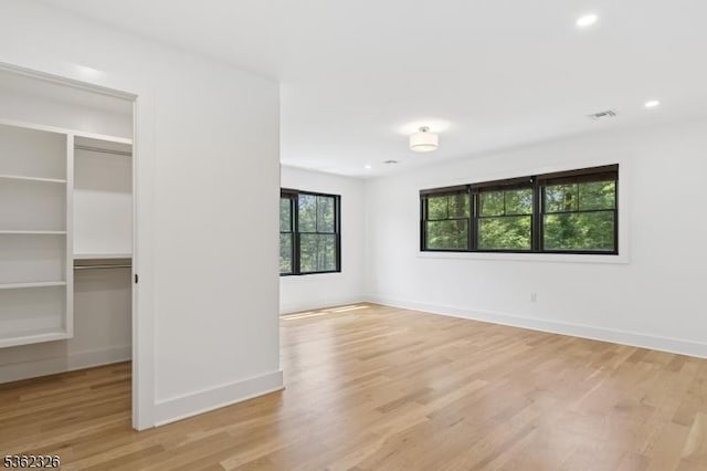 121 Culberson Rd, Bernards Twp, NJ 07920 - unfurnished bedroom featuring light wood-style flooring, a spacious closet, baseboards, a closet, and recessed lighting