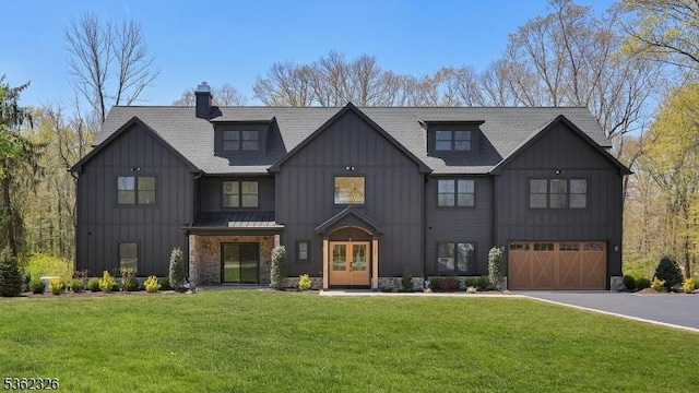 121 Culberson Rd, Bernards Twp, NJ 07920 - modern farmhouse featuring board and batten siding, french doors, driveway, a garage, and a chimney