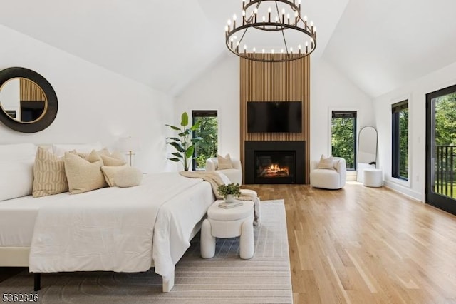 121 Culberson Rd, Bernards Twp, NJ 07920 - bedroom with wood finished floors, high vaulted ceiling, a fireplace, and a chandelier