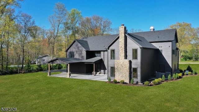 121 Culberson Rd, Bernards Twp, NJ 07920 - back of house featuring a lawn, a patio, cooling unit, and a chimney