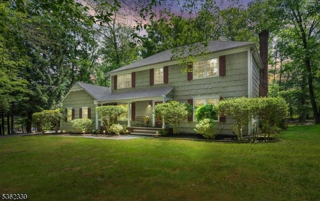 18 Wilderness Trl, Warren Twp, NJ 07059 - view of front of property with a chimney, a yard, and a porch