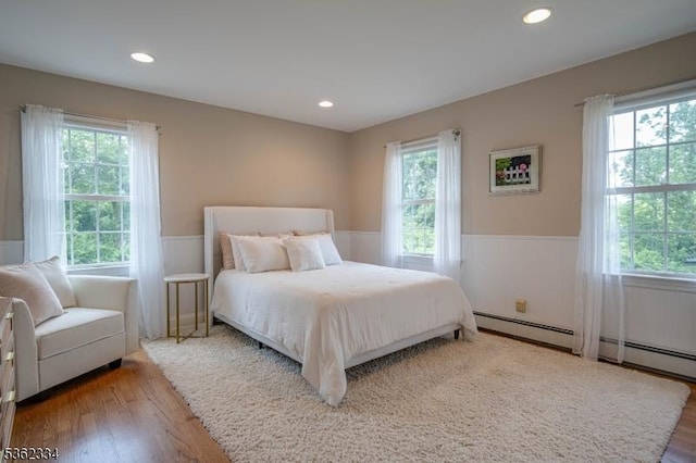 22 Hilltop Cir, Mendham Twp, NJ 07945 - bedroom with a wainscoted wall, multiple windows, wood finished floors, and recessed lighting
