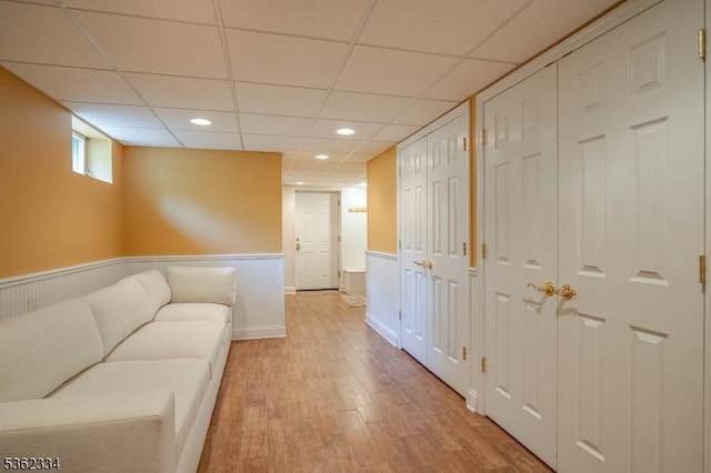 22 Hilltop Cir, Mendham Twp, NJ 07945 - living area with light wood finished floors, a wainscoted wall, a drop ceiling, and recessed lighting