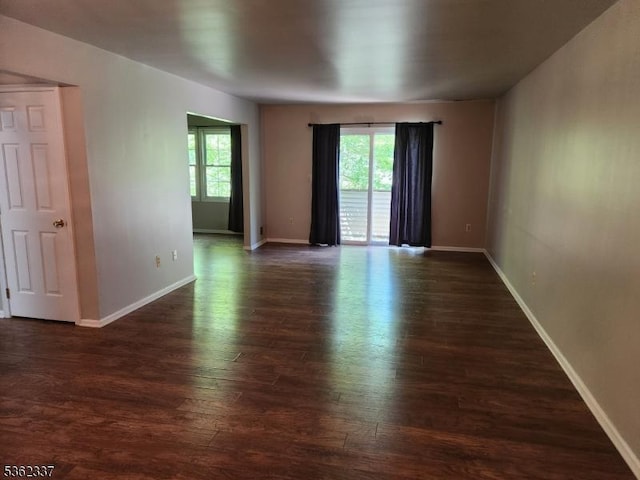 5102 Austin Ct Unit 02, Independence Twp, NJ 07840 - unfurnished room featuring healthy amount of natural light, dark wood-style flooring, and baseboards