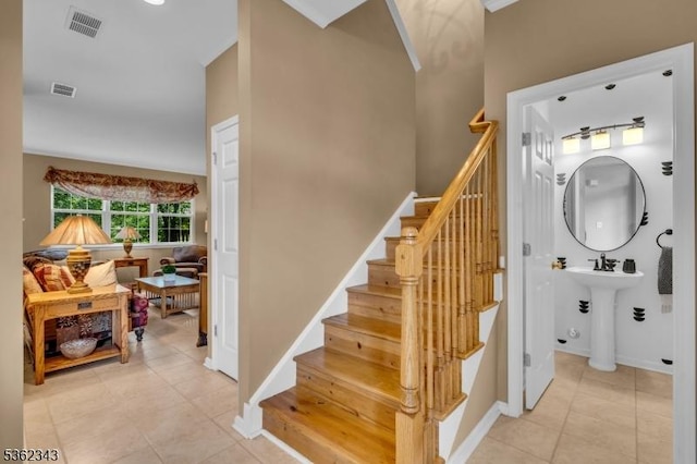 70 River Birch Cir, Montgomery Twp, NJ 08540 - staircase featuring tile patterned floors and a towering ceiling