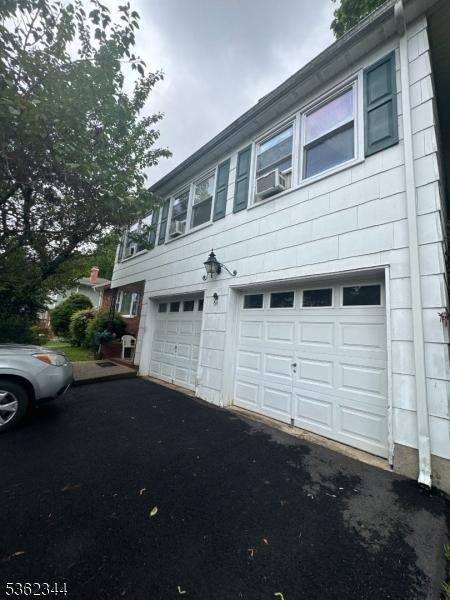 61 N Hillside Ave, Roxbury Twp, NJ 07847 - view of side of property with a garage and driveway
