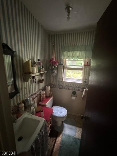 61 N Hillside Ave, Roxbury Twp, NJ 07847 - half bathroom with toilet, wallpapered walls, and a sink