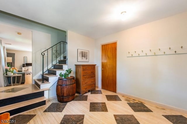 40 Riveredge Dr, Fairfield Twp, NJ 07004 - entryway with wood finished floors, stairway, and baseboards