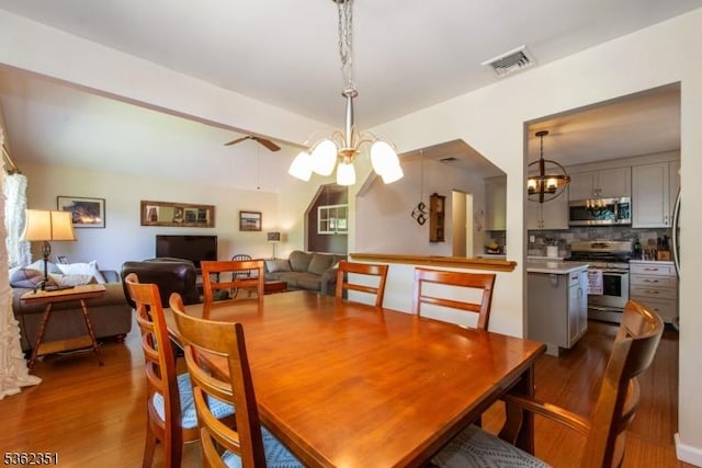 40 Riveredge Dr, Fairfield Twp, NJ 07004 - dining space featuring dark wood-type flooring, a chandelier, and ceiling fan