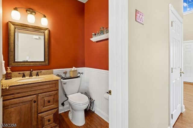 15 Middlesworth Farm Rd, Washington Twp, NJ 07853 - bathroom featuring toilet, a wainscoted wall, vanity, and wood finished floors