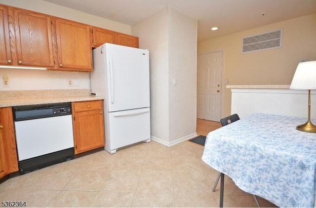 197 Potomac Dr, Bernards Twp, NJ 07920 - kitchen featuring white appliances, light countertops, brown cabinetry, recessed lighting, and light tile patterned flooring