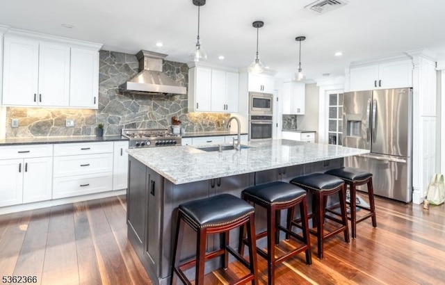 1417 Long Hill Rd, Long Hill Twp, NJ 07946 - kitchen featuring stainless steel appliances, wall chimney range hood, a sink, dark wood finished floors, and backsplash