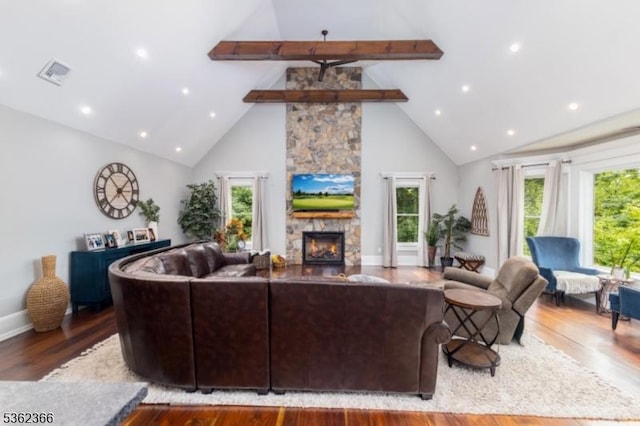 1417 Long Hill Rd, Long Hill Twp, NJ 07946 - living room with high vaulted ceiling, a stone fireplace, beam ceiling, wood finished floors, and recessed lighting