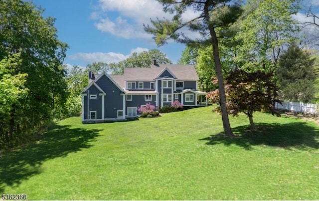 1417 Long Hill Rd, Long Hill Twp, NJ 07946 - back of property featuring a chimney and a yard