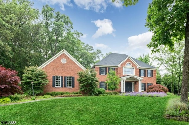 16 Olde York Rd, Randolph Twp, NJ 07869 - view of front facade featuring a front lawn and brick siding