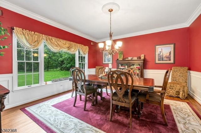 16 Olde York Rd, Randolph Twp, NJ 07869 - dining space featuring wood finished floors, a chandelier, plenty of natural light, ornamental molding, and wainscoting