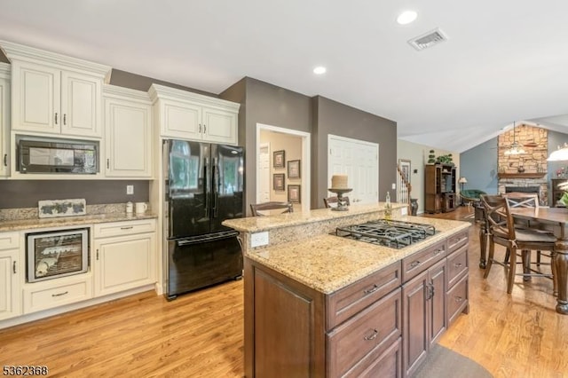 16 Olde York Rd, Randolph Twp, NJ 07869 - kitchen featuring freestanding refrigerator, black microwave, gas stovetop, light wood-type flooring, and lofted ceiling
