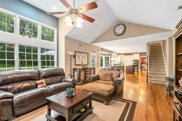 16 Olde York Rd, Randolph Twp, NJ 07869 - living room featuring high vaulted ceiling, ceiling fan, light wood-style flooring, and stairs