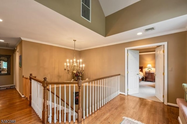 16 Olde York Rd, Randolph Twp, NJ 07869 - corridor with wood finished floors, an upstairs landing, recessed lighting, a chandelier, and ornamental molding