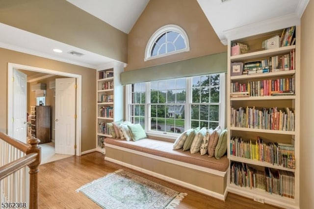 16 Olde York Rd, Randolph Twp, NJ 07869 - living area with wood finished floors, built in shelves, ornamental molding, and lofted ceiling