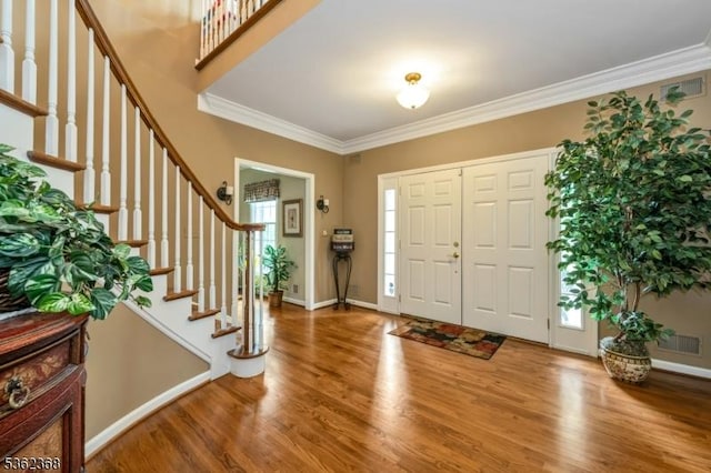 16 Olde York Rd, Randolph Twp, NJ 07869 - foyer entrance with wood finished floors, stairs, and ornamental molding