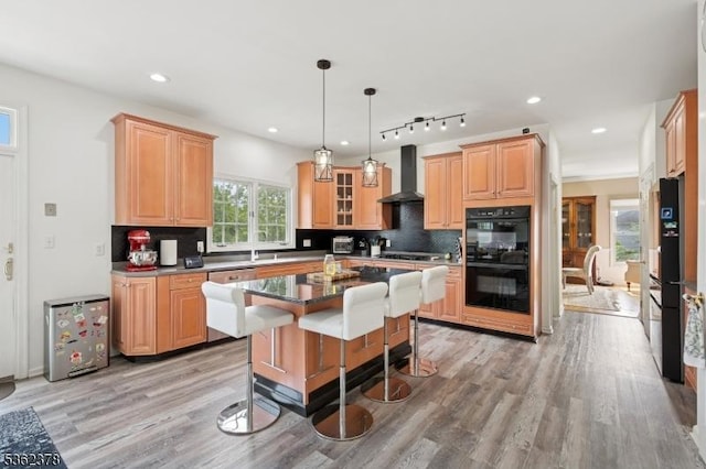 7 Cranberry Ct, North Haledon Boro, NJ 07508 - kitchen with black appliances, wall chimney range hood, light wood-style flooring, backsplash, and recessed lighting
