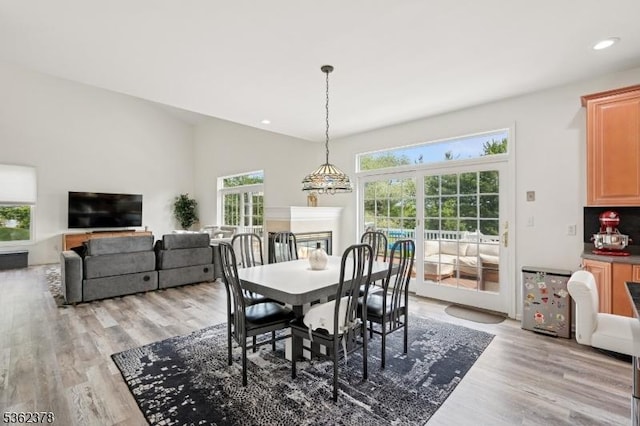 7 Cranberry Ct, North Haledon Boro, NJ 07508 - dining space featuring light wood-type flooring, recessed lighting, and a multi sided fireplace