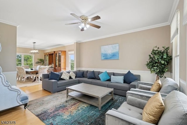 7 Cranberry Ct, North Haledon Boro, NJ 07508 - living area with wood finished floors, ornamental molding, a ceiling fan, and a chandelier