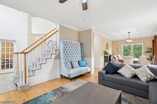 7 Cranberry Ct, North Haledon Boro, NJ 07508 - living area featuring wood finished floors, stairway, a chandelier, ornamental molding, and a ceiling fan