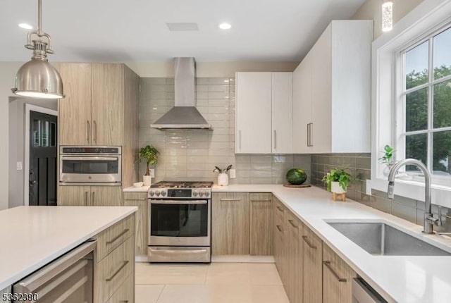 334 Durie Ave, Closter Boro, NJ 07624 - kitchen with appliances with stainless steel finishes, wall chimney range hood, beverage cooler, a sink, and backsplash