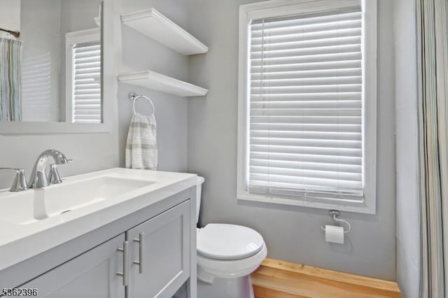 23 Foundry St, Newark City, NJ 07105 - full bath with toilet, vanity, healthy amount of natural light, and wood finished floors