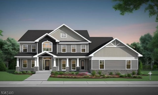 322 Andover Sparta Rd, Andover Twp, NJ 07821 - craftsman-style house with board and batten siding, stone siding, and a yard