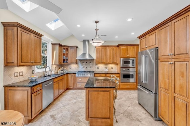 61 Bradley Ln, Bridgewater Twp, NJ 08807 - kitchen with appliances with stainless steel finishes, wall chimney exhaust hood, a skylight, brown cabinets, and recessed lighting