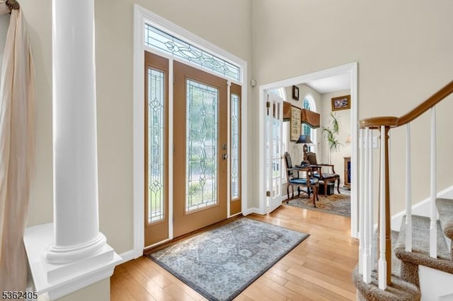 61 Bradley Ln, Bridgewater Twp, NJ 08807 - entryway with stairway, healthy amount of natural light, light wood-style floors, and a high ceiling