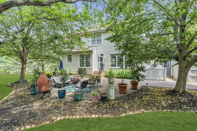 61 Bradley Ln, Bridgewater Twp, NJ 08807 - rear view of property with a patio