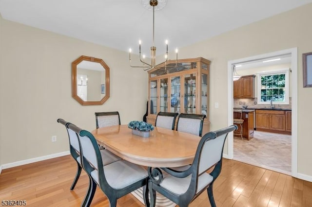 61 Bradley Ln, Bridgewater Twp, NJ 08807 - dining space with a chandelier and light wood-style floors