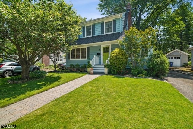 534 Summit Ave, Maplewood Twp, NJ 07040 - view of front of home featuring an outbuilding, a chimney, a garage, a front yard, and asphalt driveway