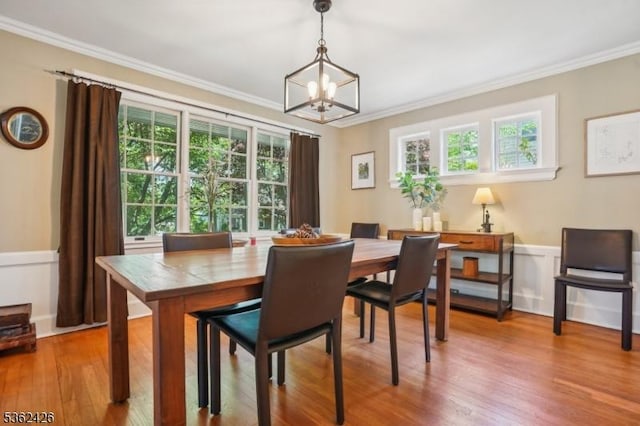 534 Summit Ave, Maplewood Twp, NJ 07040 - dining room featuring plenty of natural light, a chandelier, crown molding, wood finished floors, and wainscoting