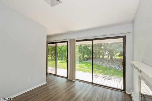 1 N Slope Unit 1, Union Twp, NJ 08809 - empty room featuring wood finished floors, baseboards, and a baseboard heating unit