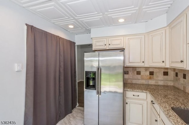 1 N Slope Unit 1, Union Twp, NJ 08809 - kitchen with stainless steel fridge with ice dispenser, cream cabinets, light stone countertops, decorative backsplash, and recessed lighting