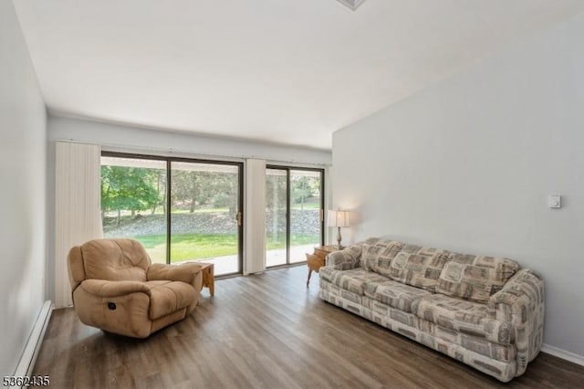 1 N Slope Unit 1, Union Twp, NJ 08809 - living area with a baseboard heating unit, wood finished floors, lofted ceiling, and baseboards