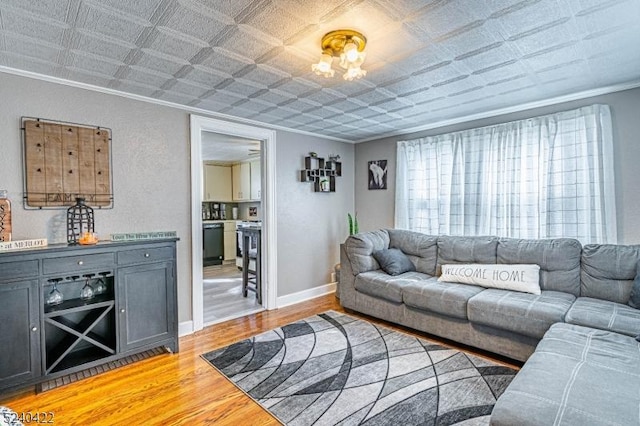 315 Green St, Boonton Town, NJ 07005 - living area featuring crown molding, light wood-type flooring, and an ornate ceiling
