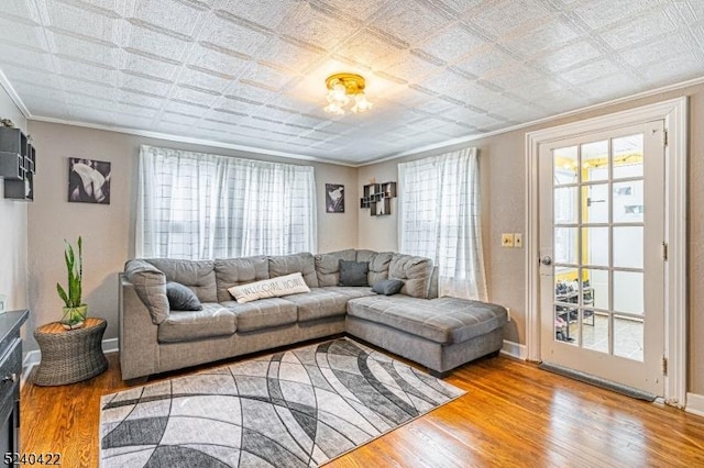 315 Green St, Boonton Town, NJ 07005 - living area with crown molding, wood finished floors, and an ornate ceiling
